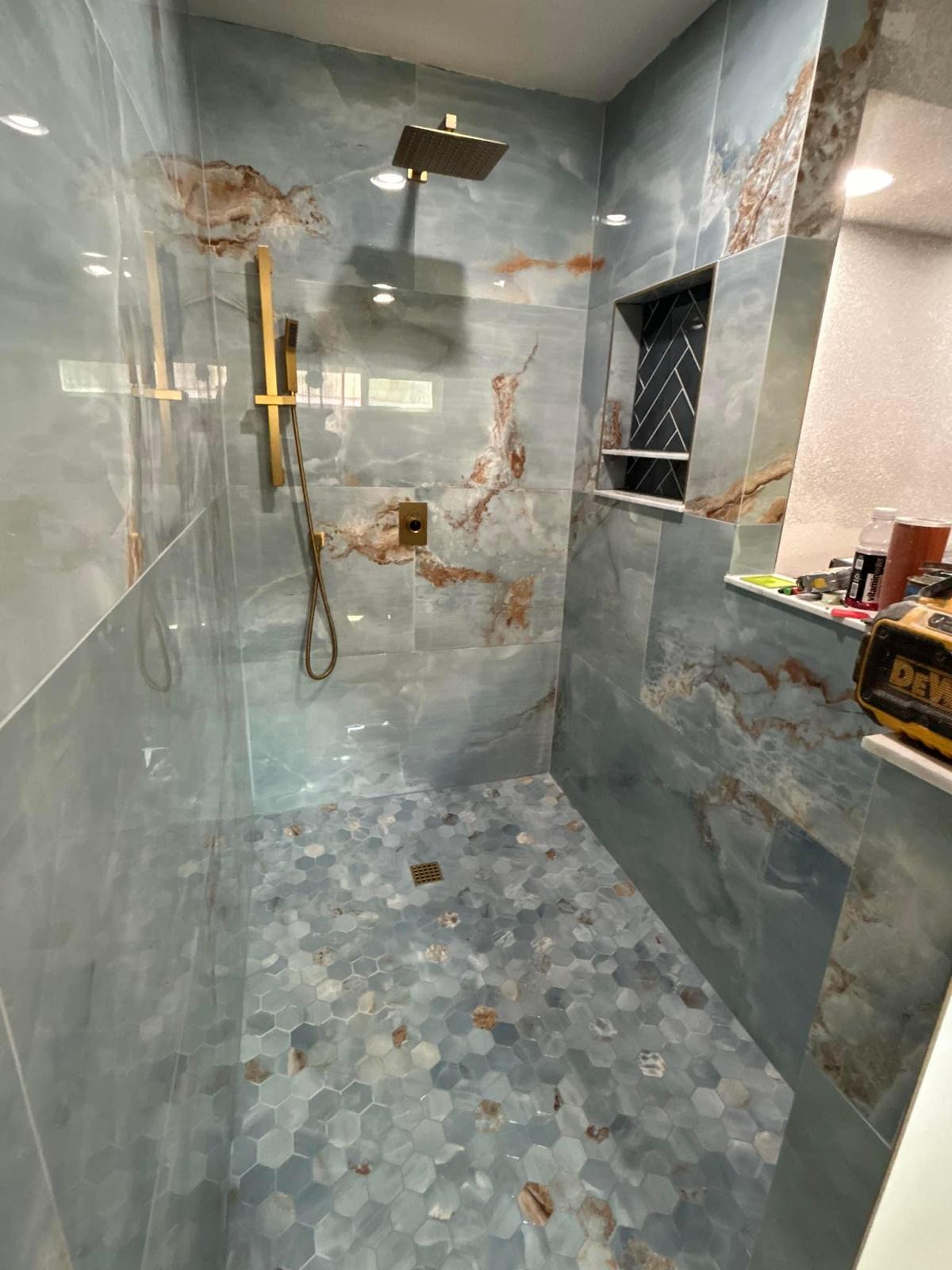 Custom blue marble-look tile shower