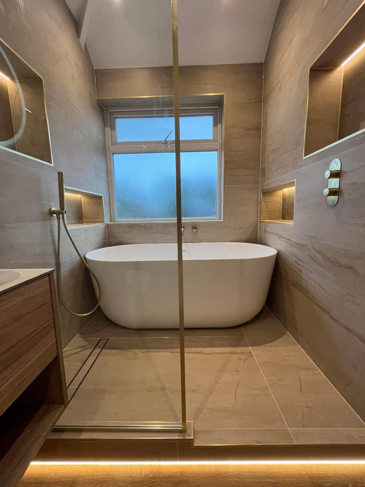 Luxury tiled bathroom with freestanding bathtub
